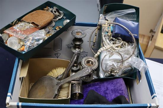 A box of assorted costume jewellery, silver napkin rings, brushes etc.